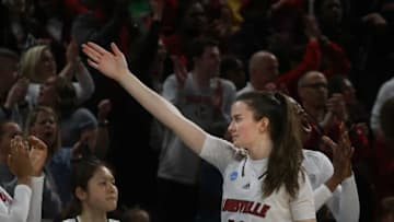 Louisville’s Payton Verhulst signals possession belongs to her Cardinals. March 26, 2022Louisvilletenn 13