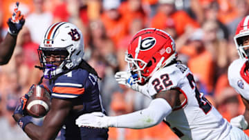 Auburn footballSep 30, 2023; Auburn, Alabama, USA; Georgia Bulldogs defensive back Javon Bullard (22) closes in on Auburn Tigers wide receiver Camden Brown (4) during the second quarter at Jordan-Hare Stadium. Mandatory Credit: John Reed-USA TODAY Sports