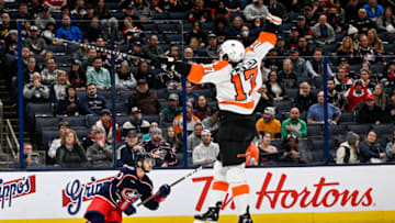 Nov 10, 2022; Columbus, Ohio, USA; Philadelphia Flyers center Zack MacEwen (17) tries to knock the puck out of the air in the third period against the Columbus Blue Jackets at Nationwide Arena. Mandatory Credit: Gaelen Morse-USA TODAY Sports