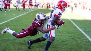 Oct 9, 2016; Columbia, SC, USA; Georgia Bulldogs wide receiver Isaiah McKenzie (16) makes a catch and drags South Carolina Gamecocks defensive back D.J. Smith (24) towards the end zone during the second half at Williams-Brice Stadium. Georgia won 28-14. Mandatory Credit: Jim Dedmon-USA TODAY Sports