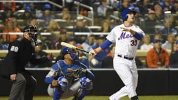 Oct 31, 2015; New York City, NY, USA; New York Mets left fielder Michael Conforto (30) hits a solo home run against the Kansas City Royals in the third inning in game four of the World Series at Citi Field. Mandatory Credit: Robert Deutsch-USA TODAY Sports