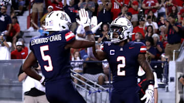 Sep 2, 2023; Tucson, Arizona, USA; Arizona Wildcats wide receiver Jacob Cowing (2) celebrates a touchdown with wide receiver Montana Lemonious-Craig (5) against the Northern Arizona Lumberjacks during the first half at Arizona Stadium. Mandatory Credit: Zac BonDurant-USA TODAY Sports