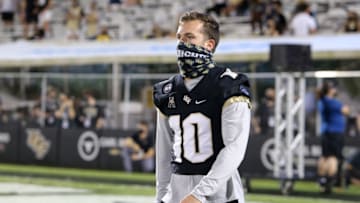ORLANDO, FL - NOVEMBER 14: McKenzie Milton #10 of the Central Florida Knights walks to sideline against the Temple Owls at Bounce House-FBC Mortgage Field on November 14, 2020 in Orlando, Florida. (Photo by Alex Menendez/Getty Images)