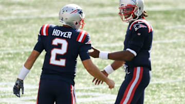 Sep 13, 2020; Foxborough, Massachusetts, USA; New England Patriots quarterback Cam Newton (1) talks with quarterback Brian Hoyer (2) during a timeout in the second half of a game against the Miami Dolphins at Gillette Stadium. Mandatory Credit: Brian Fluharty-USA TODAY Sports