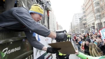 Feb 4, 2015; Boston, MA, USA; New England Patriots tight end Rob Gronkowski signs a poster for a fan during the Super Bowl XLIX victory parade. Mandatory Credit: Stew Milne-USA TODAY Sports