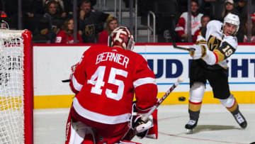 DETROIT, MI - NOVEMBER 10: Reilly Smith #19 of the Vegas Golden Knights shoots the puck as goaltender Jonathan Bernier #45 of the Detroit Red Wings looks to make a save during an NHL game at Little Caesars Arena on November 10, 2019 in Detroit, Michigan. (Photo by Dave Reginek/NHLI via Getty Images)