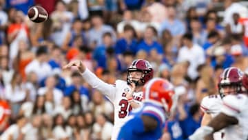 South Carolina football's Special Teams Coordinator Pete Lembo has utilized the third phase of the game in unique ways, including having punter Kai Kroeger throw passes. [Doug Engle/Gainesville Sun]