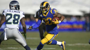 LOS ANGELES, CA - NOVEMBER 11: Todd Gurley #30 of the Los Angeles Rams rushes against the Seattle Seahawks at Los Angeles Memorial Coliseum on November 11, 2018 in Los Angeles, California. (Photo by John McCoy/Getty Images)