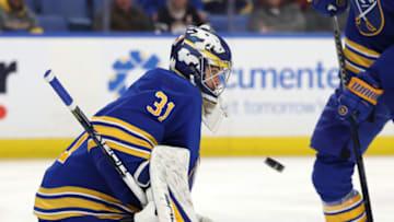 Nov 8, 2022; Buffalo, New York, USA; Buffalo Sabres goaltender Eric Comrie (31) looks to make a save during the third period against the Arizona Coyotes at KeyBank Center. Mandatory Credit: Timothy T. Ludwig-USA TODAY Sports
