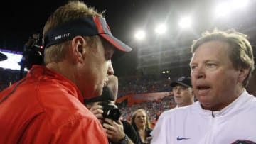 Oct 3, 2015; Gainesville, FL, USA; Mississippi Rebels head coach Hugh Freezea and Florida Gators head coach Jim McElwain greet after the game during the second half at Ben Hill Griffin Stadium. Florida Gators defeated the Mississippi Rebels 38-10. Mandatory Credit: Kim Klement-USA TODAY Sports