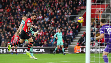 SOUTHAMPTON, ENGLAND - DECEMBER 16: Danny Ings of Southampton scores his team's first goal under pressure from Laurent Koscielny of Arsenal during the Premier League match between Southampton FC and Arsenal FC at St Mary's Stadium on December 16, 2018 in Southampton, United Kingdom. (Photo by Catherine Ivill/Getty Images)