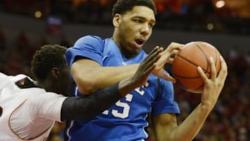Jan 17, 2015; Louisville, KY, USA; Duke Blue Devils center Jahlil Okafor (15) battles Louisville Cardinals forward/center Mangok Mathiang (12) for a rebound during the second half at KFC Yum! Center. Duke defeated Louisville 63-52. Mandatory Credit: Jamie Rhodes-USA TODAY Sports