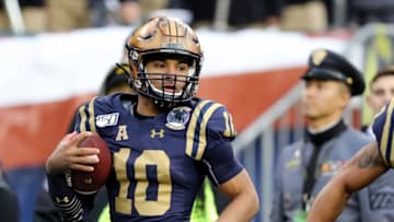 PHILADELPHIA, PENNSYLVANIA - DECEMBER 14: Malcolm Perry #10 of the Navy Midshipmen scores a touchdown in second quarter against the Army Black Knights at Lincoln Financial Field on December 14, 2019 in Philadelphia, Pennsylvania. (Photo by Elsa/Getty Images)