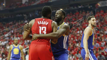 HOUSTON, TX - MAY 04: Draymond Green #23 of the Golden State Warriors grabs James Harden #13 of the Houston Rockets after a foul in the first quarter during Game Three of the Second Round of the 2019 NBA Western Conference Playoffs at Toyota Center on May 4, 2019 in Houston, Texas. NOTE TO USER: User expressly acknowledges and agrees that, by downloading and or using this photograph, User is consenting to the terms and conditions of the Getty Images License Agreement. (Photo by Tim Warner/Getty Images)