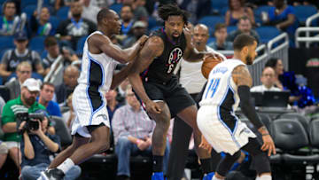 ORLANDO, FL - DECEMBER 14: DeAndre Jordan #6 of the LA Clippers is guarded by Bismack Biyombo #11 of the Orlando Magic at Amway Center on December 14, 2016 in Orlando, Florida. NOTE TO USER: User expressly acknowledges and agrees that, by downloading and or using this photograph, User is consenting to the terms and conditions of the Getty Images License Agreement. (Photo by Manuela Davies/Getty Images)
