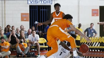 Nov 22, 2016; Maui, HI, USA; Tennessee Volunteers guard Lamonte Turner (1) scrambles for a loose ball against Oregon Ducks forward Jordan Bell (1) during the Maui Jim Maui Invitational at the Lahaina Civic Center. Mandatory Credit: Brian Spurlock-USA TODAY Sports