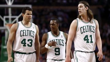 Mar 5, 2014; Boston, MA, USA; Boston Celtics center Kris Humphries (43), point guard Rajon Rondo (9) and center Kelly Olynyk (41) react during the first half of a game against the Golden State Warriors at TD Garden. Mandatory Credit: Mark L. Baer-USA TODAY Sports