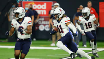 LAS VEGAS, NEVADA - SEPTEMBER 04: Wide receiver Tayvian Cunningham #11 of the Arizona Wildcats returns a punt against the Brigham Young Cougars during the Good Sam Vegas Kickoff Classic at Allegiant Stadium on September 4, 2021 in Las Vegas, Nevada. The Cougars defeated the Wildcats 24-16. (Photo by Ethan Miller/Getty Images)