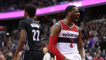 Jan 6, 2017; Washington, DC, USA; Washington Wizards guard John Wall (2) celebrates on the court in front of Minnesota Timberwolves forward Andrew Wiggins (22) in the fourth quarter at Verizon Center. The Wizards won 112-105. Mandatory Credit: Geoff Burke-USA TODAY Sports