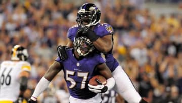 Sep 11, 2014; Baltimore, MD, USA; Baltimore Ravens linebacker C.J. Mosley (57) is congratulated by linebacker Elvis Dumervil (58) after recovering a fumble in the fourth quarter against the Pittsburgh Steelers at M&T Bank Stadium. Mandatory Credit: Evan Habeeb-USA TODAY Sports