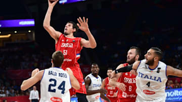 Serbia's center Boban Marjanovich (2L) tries to score a basket next to Italy's forward Filippo Rosssi Baldi (L) during the FIBA Eurobasket 2017 men's quarter-final basketball match between Italy and Serbia at Sinan Erdem Sport Arena in Istanbul on September 13, 2017. / AFP PHOTO / OZAN KOSE (Photo credit should read OZAN KOSE/AFP/Getty Images)