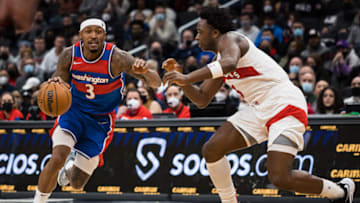 WASHINGTON, DC - JANUARY 21: Bradley Beal #3 of the Washington Wizards goes to the basket against OG Anunoby #3 of the Toronto Raptors during the second half at Capital One Arena on January 21, 2022 in Washington, DC. NOTE TO USER: User expressly acknowledges and agrees that, by downloading and or using this photograph, User is consenting to the terms and conditions of the Getty Images License Agreement. (Photo by Scott Taetsch/Getty Images)