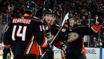 ANAHEIM, CA - DECEMBER 29: Jakob Silfverberg #33, Adam Henrique #14, and Josh Mahura #76 of the Anaheim Ducks celebrate a goal in the first period of the game against the Arizona Coyotes on December 29, 2018 at Honda Center in Anaheim, California. (Photo by Debora Robinson/NHLI via Getty Images)