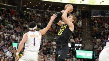 Nov 19, 2023; Salt Lake City, Utah, USA; Utah Jazz forward Lauri Markkanen (23) shoots over Phoenix Suns guard Devin Booker (1) during the second half at Delta Center. Mandatory Credit: Chris Nicoll-USA TODAY Sports