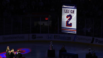 Former New York Ranger Brian Leetch watches his retired banner being raised to the rafters . (Photo by Mike Stobe/Getty Images)