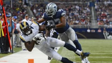 Sep 21, 2014; St. Louis, MO, USA; Dallas Cowboys strong safety J.J. Wilcox (27) knocks St. Louis Rams tight end Jared Cook (89) out of bounds during the second half at the Edward Jones Dome. The Dallas Cowboys defeat the St. Louis Rams 34-31. Mandatory Credit: Jasen Vinlove-USA TODAY Sports