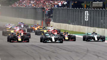 MEXICO CITY, MEXICO - OCTOBER 28: Max Verstappen of the Netherlands driving the (33) Aston Martin Red Bull Racing RB14 TAG Heuer, Lewis Hamilton of Great Britain driving the (44) Mercedes AMG Petronas F1 Team Mercedes WO9, Daniel Ricciardo of Australia driving the (3) Aston Martin Red Bull Racing RB14 TAG Heuer and Valtteri Bottas driving the (77) Mercedes AMG Petronas F1 Team Mercedes WO9 battle for position at the start during the Formula One Grand Prix of Mexico at Autodromo Hermanos Rodriguez on October 28, 2018 in Mexico City, Mexico. (Photo by Mark Thompson/Getty Images)