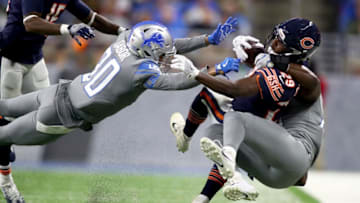 DETROIT, MI - DECEMBER 16: Chicago Bears running back Tarik Cohen #29 is tackled by Detroit Lions cornerback Teez Tabor #30 during the second half at Ford Field on December 16, 2017 in Detroit, Michigan. (Photo by Gregory Shamus/Getty Images)