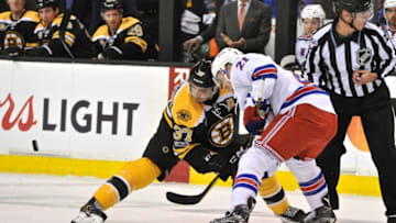 BOSTON, MA - MARCH 02: Boston Bruins Center Patrice Bergeron (37) beats New York Rangers Center Derek Stepan (21) on the face off. During the Boston Bruins game against the New York Rangers on March 2, 2017 at TD Bank Garden in Boston, MA. (Photo by Michael Tureski/Icon Sportswire via Getty Images)