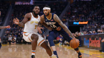 SAN FRANCISCO, CALIFORNIA - DECEMBER 20: Brandon Ingram #14 of the New Orleans Pelicans drives to the basket against Eric Paschall #7 of the Golden State Warriors in the first half at Chase Center on December 20, 2019 in San Francisco, California. NOTE TO USER: User expressly acknowledges and agrees that, by downloading and/or using this photograph, user is consenting to the terms and conditions of the Getty Images License Agreement. (Photo by Lachlan Cunningham/Getty Images)