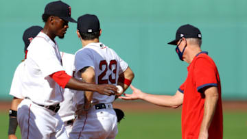 BOSTON, MASSACHUSETTS - SEPTEMBER 06: Boston Red Sox manager Ron Roenicke relieves Robinson Leyer #77 during the sixth inning against the Toronto Blue Jays at Fenway Park on September 06, 2020 in Boston, Massachusetts. (Photo by Maddie Meyer/Getty Images)