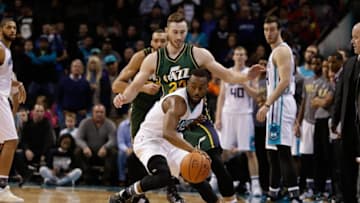 Jan 18, 2016; Charlotte, NC, USA; Charlotte Hornets guard Kemba Walker (15) controls the ball while being guarded by Utah Jazz forward Gordon Hayward (20) in the second half at Time Warner Cable Arena. The Hornets defeated the Jazz in two overtimes 124-119. Mandatory Credit: Jeremy Brevard-USA TODAY Sports