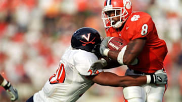 11 Sep 1999: Travis Zachery #8 of the Clemson Tigers moves with the ball away from Chris Williams #29 of the Virginia Cavaliers during the game at the Memorial Stadium in Clemson, North Carolina. The Cavaliers defeated the Tigers 33-14.