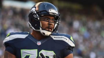September 4, 2014; Seattle, WA, USA; Seattle Seahawks tackle Garry Gilliam (79) warms up before the game against the Green Bay Packers at CenturyLink Field. Mandatory Credit: Kyle Terada-USA TODAY Sports