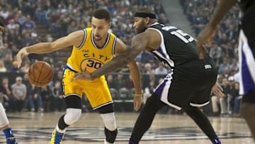Jan 9, 2016; Sacramento, CA, USA; Golden State Warriors guard Stephen Curry (30) drives to the basket against Sacramento Kings center DeMarcus Cousins (15) during the first quarter at Sleep Train Arena. Mandatory Credit: Ed Szczepanski-USA TODAY Sports