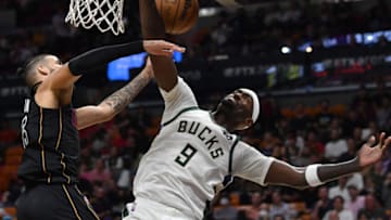 Miami Heat forward Caleb Martin (16) blocks the shot of Milwaukee Bucks center Bobby Portis (9)(Jim Rassol-USA TODAY Sports)