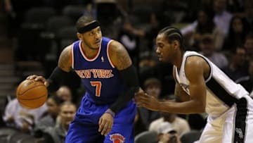 Jan 2, 2014; San Antonio, TX, USA; New York Knicks forward Carmelo Anthony (7) is defended by San Antonio Spurs forward Kawhi Leonard (right) during the second half at AT