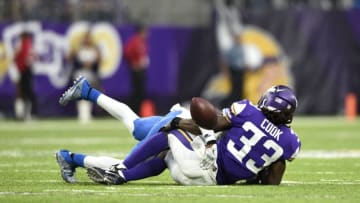 MINNEAPOLIS, MN - OCTOBER 1: Dalvin Cook #33 of the Minnesota Vikings grabs his knee after fumbling the ball while being tackled by defender Tavon Wilson #32 of the Detroit Lions in the third quarter of the game on October 1, 2017 at U.S. Bank Stadium in Minneapolis, Minnesota. Cook was injured on the play and left the game for the locker room. (Photo by Hannah Foslien/Getty Images)