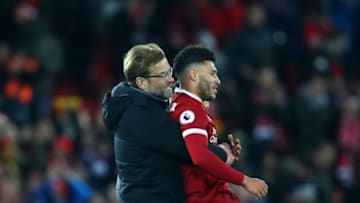 LIVERPOOL, ENGLAND - DECEMBER 30: Jurgen Klopp, Manager of Liverpool carries Alex Oxlade-Chamberlain of Liverpool off the pitch after the Premier League match between Liverpool and Leicester City at Anfield on December 30, 2017 in Liverpool, England. (Photo by Clive Brunskill/Getty Images)