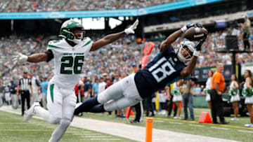 EAST RUTHERFORD, NEW JERSEY - OCTOBER 03: (NEW YORK DAILIES OUT) Josh Reynolds #18 of the Tennessee Titans in action against Brandin Echols #26 of the New York Jets at MetLife Stadium on October 03, 2021 in East Rutherford, New Jersey. The Jets defeated the Titans 27-24 in overtime. (Photo by Jim McIsaac/Getty Images)