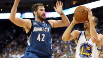 Apr 14, 2014; Oakland, CA, USA; Golden State Warriors guard Stephen Curry (30) shoots the ball against Minnesota Timberwolves forward Kevin Love (42) during the third quarter at Oracle Arena. The Golden State Warriors defeated the Minnesota Timberwolves 130-120. Mandatory Credit: Kelley L Cox-USA TODAY Sports