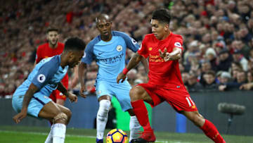 LIVERPOOL, ENGLAND - DECEMBER 31: Roberto Firmino of Liverpool takes on Raheem Sterling of Manchester City during the Premier League match between Liverpool and Manchester City at Anfield on December 31, 2016 in Liverpool, England. (Photo by Clive Brunskill/Getty Images)