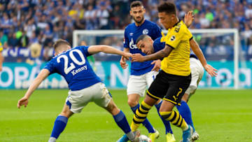 GELSENKIRCHEN, GERMANY - OCTOBER 26: Jonjoe Kenny of FC Schalke 04, Omar Mascarell of FC Schalke 04 and Jadon Sancho of Borussia Dortmund battle for the ball during the Bundesliga match between FC Schalke 04 and Borussia Dortmund at Veltins-Arena on October 26, 2019 in Gelsenkirchen, Germany. (Photo by TF-Images/Getty Images)