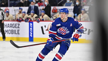 LAVAL, QC - APRIL 08: Ethan Prow #7 of the Rochester Americans skates against the Laval Rocket during the second period at Place Bell on April 8, 2022 in Laval, Canada. The Laval Rocket defeated the Rochester Americans 4-3 in overtime. (Photo by Minas Panagiotakis/Getty Images)