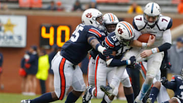 Auburn footballNov 23, 2019; Auburn, AL, USA; Auburn Tigers defenders Colby Wooden (25), Zakoby McClain (35) and Jordyn Peters (15) tackle Samford Bulldogs quarterback Liam Welch (7) during the third quarter at Jordan-Hare Stadium. Mandatory Credit: John Reed-USA TODAY Sports