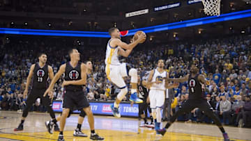 March 23, 2016; Oakland, CA, USA; Golden State Warriors guard Stephen Curry (30) shoots the basketball against the Los Angeles Clippers during the fourth quarter at Oracle Arena. The Warriors defeated the Clippers 114-98. Mandatory Credit: Kyle Terada-USA TODAY Sports